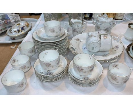 A Rosenthal Bavarian tea service, 12 settings, floral decoration with gilt borders 