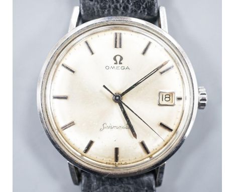 A gentleman's stainless steel Omega Seamaster manual wind wrist watch, on associated black leather strap, case diameter 35mm.