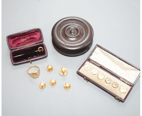 A yellow metal signet ring(a.f.) 7.1 grams, four assorted yellow metal dress studs stamped 18, 7 grams, one other stud stampe