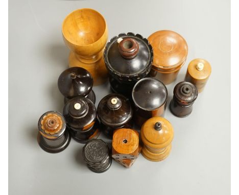 Nine Victorian turned or carved treen match holders with ‘go to bed’ finials, a treen double measure, cased glass measure and