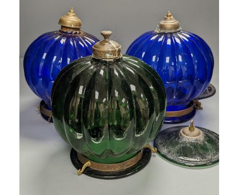 Three coloured glass pendant fluted globe shaped lamps - two blue, one green,30 cms high.