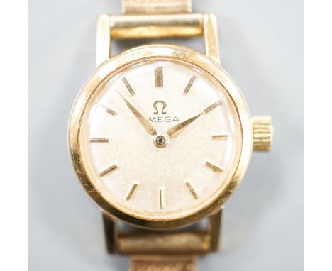 A lady's 1960's steel and gold plated Omega manual wind wrist watch, on an associated 9ct gold bracelet,gross weight 17.5 gra