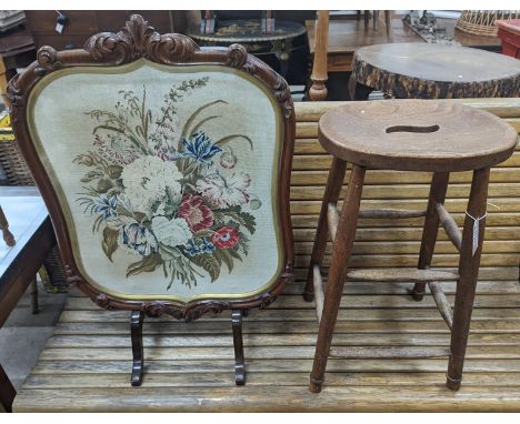 An elm and beech stool together with a Victorian rosewood tapestry firescreen