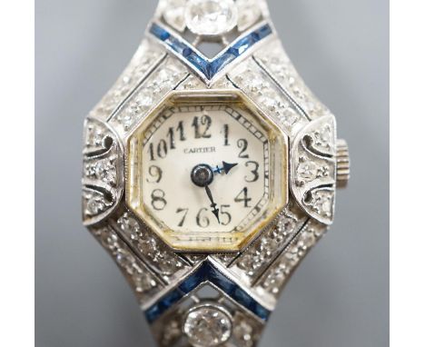 A mid 20th century white metal, synthetic sapphire? and diamond set cocktail watch, with Bucherer manual wind movement and di