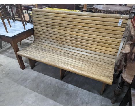 A vintage slatted wood tram bench, length 140cm, depth 60cm, height 98cm