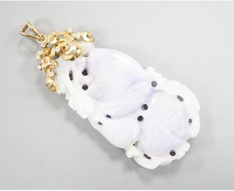 A 14k yellow metal mounted carved jade and diamond chip set pendant, overall 66mm, gross weight 19.4 grams.