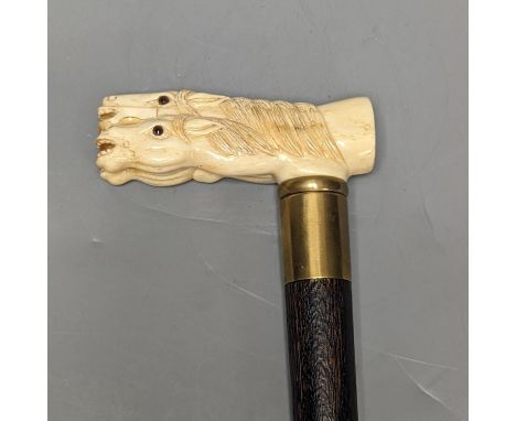 A bone 'horse head' handled walking stick 90cm