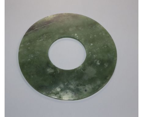 A Chinese spinach green jade bi disc 15.4cm