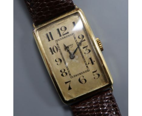 A gentleman's 1930's/1940's? yellow metal manual wind wrist watch, retailed by Asprey, (one lug a.f.), on later associated le