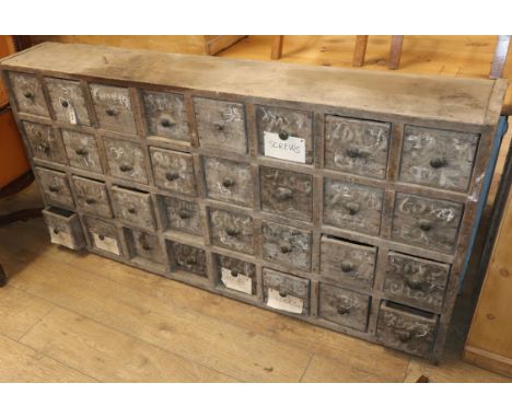 A vintage bank of 32 drawers W.164cm