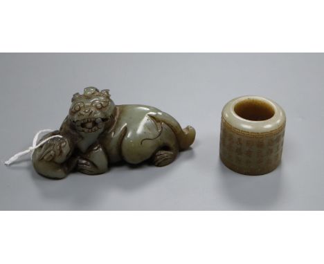 A jade carved lion-dog and an archer's ring