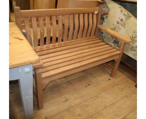 A modern teak garden bench W.130cm