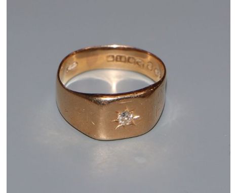 A gentlemens' 18ct gold wedding ring, gypsy-set with a single diamond, size R.