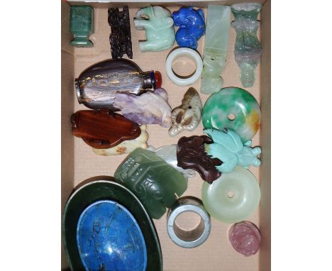 A group of Chinese stone carvings, a spinach green jade dish and a lapis lazuli dish