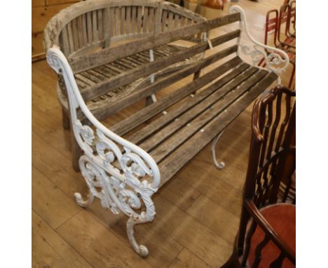 A Victorian style cast iron slatted garden bench W.182cm
