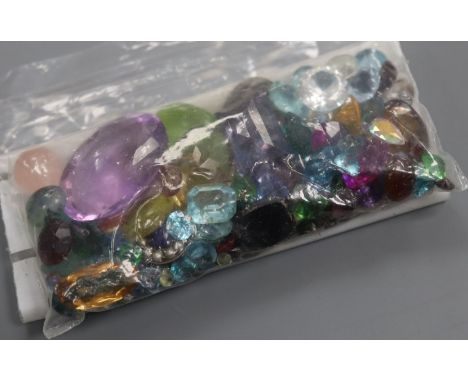 A quantity of assorted unmounted cut paste and gemstones, including amethyst, citrine, opal and garnet.