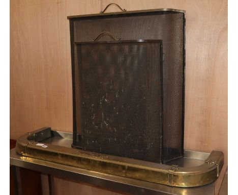 A brass fender, fire tools, pot hanger, etc.