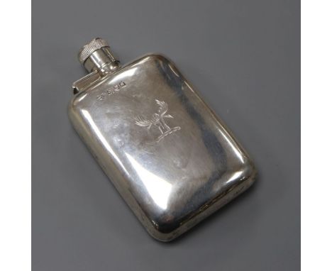 A George V silver hip flask by Goldsmiths &amp; Silversmiths Co Ltd, London, 1913, with engraved crest, 11.4cm, 110 grams.