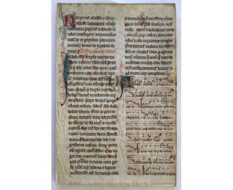 A MANUSCRIPT LEAF possibly French, c.1400, each side with two columns of text and several staves of musical notation, initial
