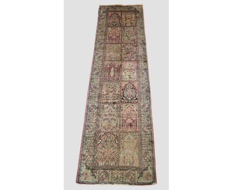 KASHMIR SILK RUNNER the polychrome compartmentalised field with two columns of Mihrabs above plants and flowers enclosed by s