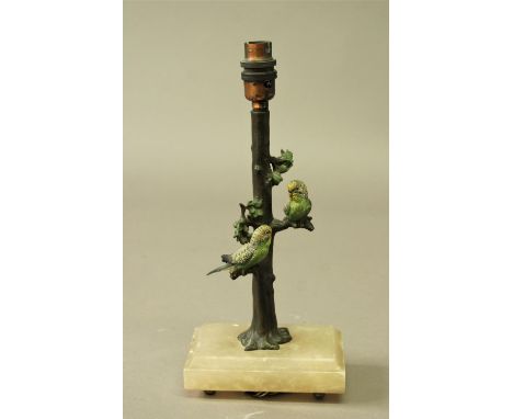 COLD PAINTED BUDGERIGAR LAMP the pair of birds one either side of a tree trunk, on an alabaster base, total height 33cm