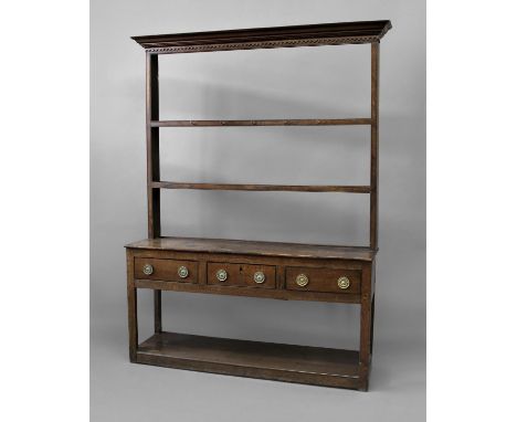 GEORGE III OAK DRESSER the two shelf rack, perhaps later, with dentil cornice on a base with three drawers and open pot shelf