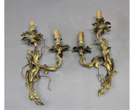 PAIR OF GILT METAL, ROCOCO STYLE WALL LIGHTS of two light, foliate form, height 42cm, width 24cm (2)