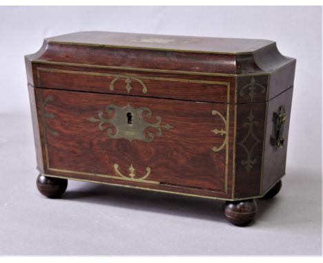 GEORGE III BRASS INLAID TEA CADDY possibly rosewood, of canted rectangular form, with glass canisters and mixing bowl, on bun