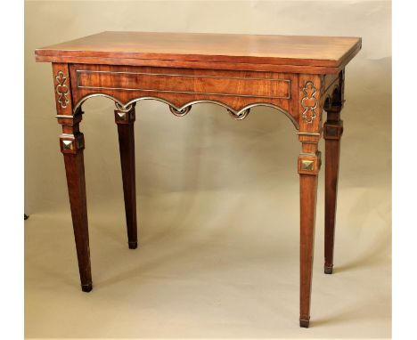 MAHOGANY, GILT AND BRASS MOUNTED FOLD OUT CARD TABLE 19th century, possibly Swedish, the top above a paneled frieze and arche