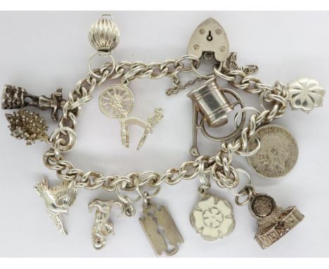 Hallmarked silver charm bracelet with twelve charms, padlock clasp and safety chain, L: 18 cm, 40g. UK P&amp;P Group 1 (£16+V