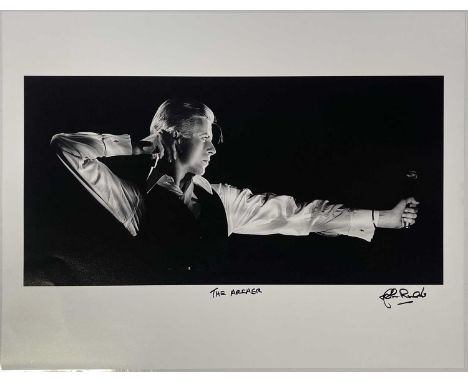 A print of an image by photographer John Rowlands depicting David Bowie onstage Feb 26th 1976 in Toronto, Canada at Maple Lea