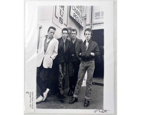 A vintage hand made photo print of an image by Virginia Turbett depicting The Clash in Leicester Square, London, 6th July 197