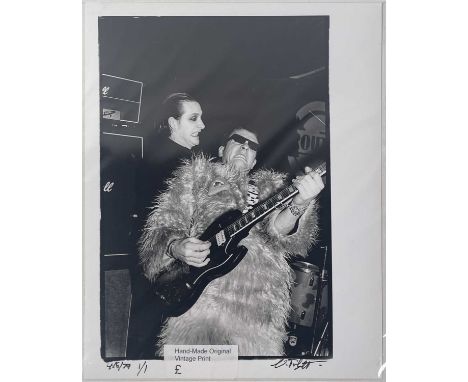 A vintage hand printed darkroom print of an image by photographer Virginia Turbett depicting The Damned onstage in Exeter, Ju