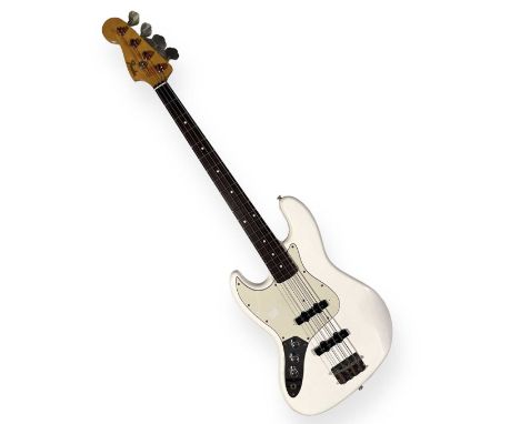 An original 1985 Fender Jazz Bass in Olympic White, Made in Japan.  Serial number: A010518 The date on the heel: 5 - 11 - 85 