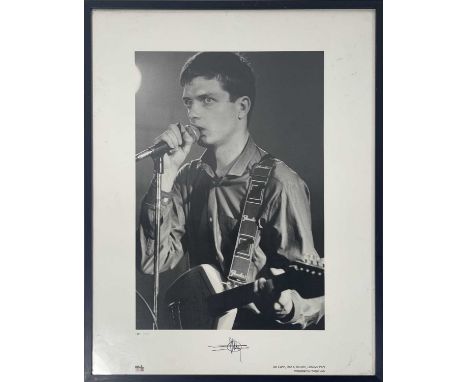 A photograph depicting Ian Curtis, onstage at Plan K, Belgium, 1979. Signed to border by photographer Philippe Carly. From an