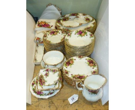 Quantity of Royal Albert Country Roses plates, bowls, saucers, sugar and cream, etc