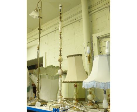 Brass and onyx standard lamp, four onyx table lamps and brass effect standard lamp