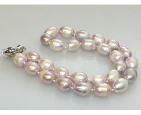 Lilac coloured freshwater pearl necklace, on a bolt ring clasp, length 47cm