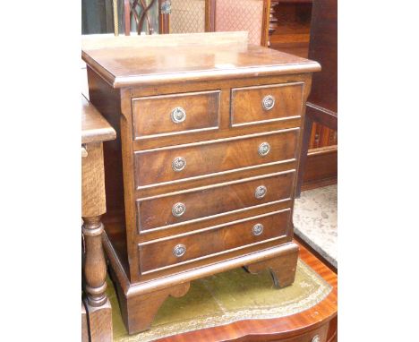 Georgian style mahogany miniature chest of two short above three long drawers on bracket feet