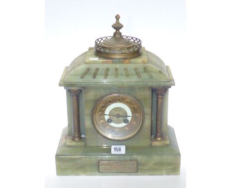 Onyx mantel clock, the circular dial flanked by fluted corinthian brass columns
