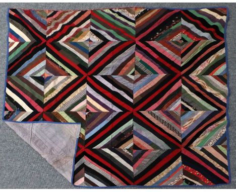 Early 20th Century Log Cabin Patchwork Cover, in the light and dark barn raising pattern, incorporating velvets, wool and oth
