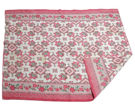 Circa 1930s Whole Cloth Quilt incorprating a vibrant pink floral design, with machine zigzag quilting, 186cm by 200cmA Family