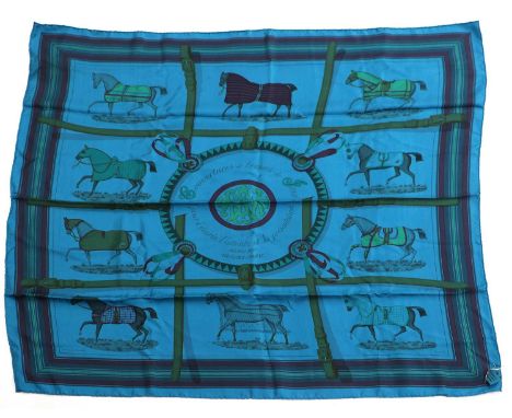 Hermés Silk Scarf Surteint Dip Dye Couvertures et Tenues de Jour on a teal blue ground, printed with horses wearing various b