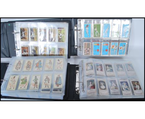 A group of four vintage cigarette cards to include military related cigarette cards such as Will's 'Military Motors', 'Britai