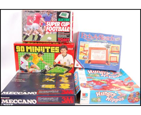 A collection of vintage board games comprising: Meccano 3M motorised set, 90 Minutes Football game, Super Cup Football, Peter