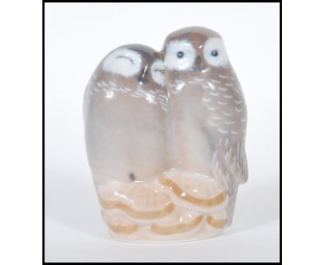 A 20th Century ceramic figure of a pair of owls by Royal Copenhagen Denmark no. 834 marks to base.&nbsp;&nbsp;Measures: 8cm t
