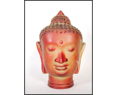 A vintage retro 20th Century red glass Buddha head featuring beaded headdress with moulded features.