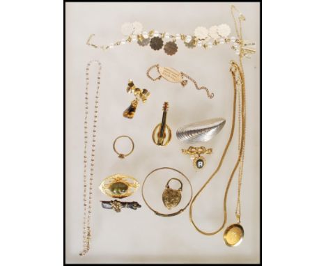 A quantity of vintage and later costume jewellery to include a silver ingot on chain, marcasite brooch, interesting black woo