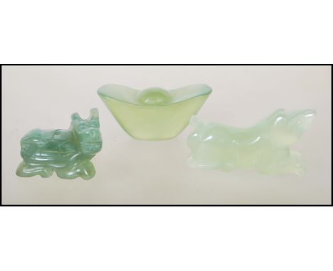 A collection of 3 Chinese jade figural sculptures to include a boat, a temple dog and a Qulin