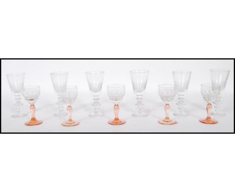 A collection of early 20th century wine glasses / sherry and port glasses to include 10 x facet cut ruby glass flash worked w